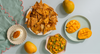 Baked Corn Nachos with Jalapeno Cheese topped with Spicy Mango Jam and Mango & Green Chilli Dip
